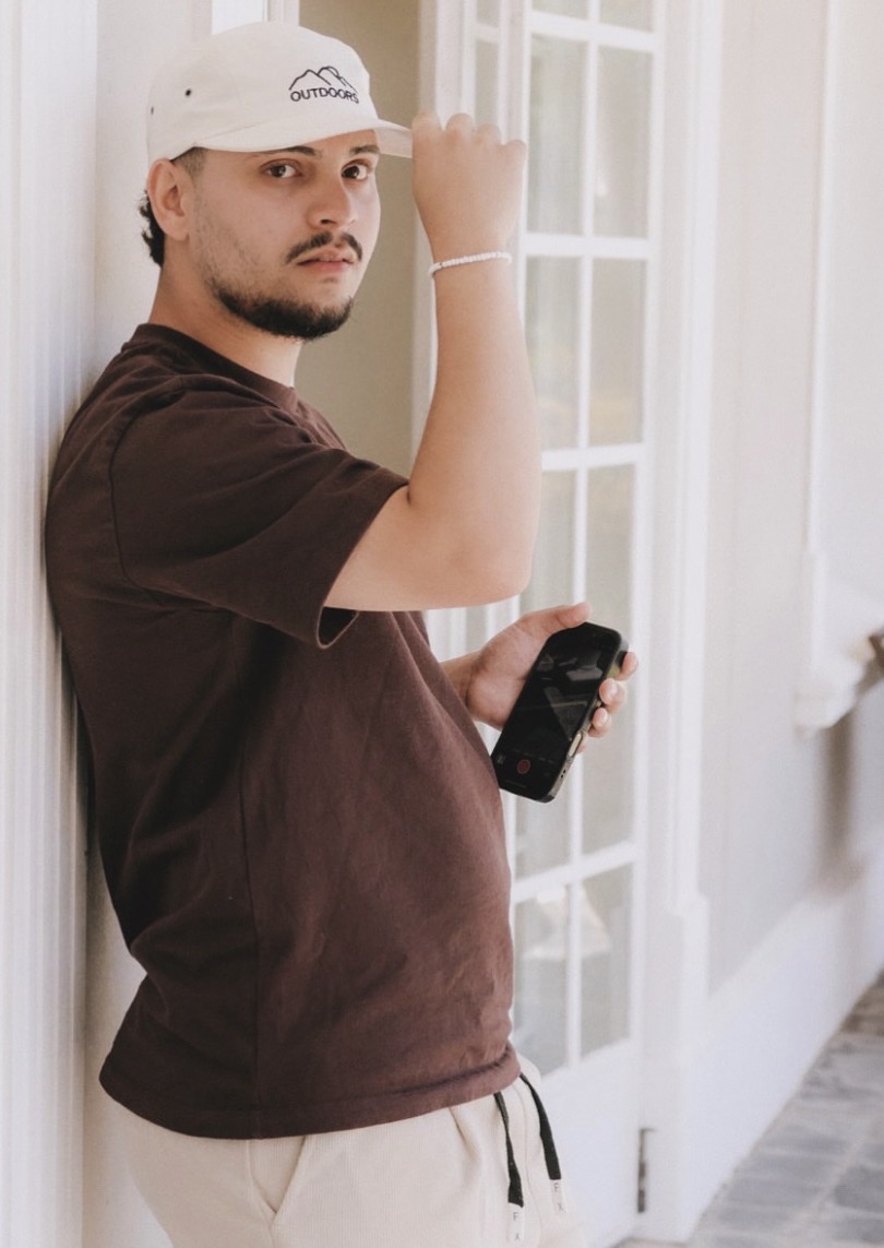 The founder of Cloudy Captures, camera in hand